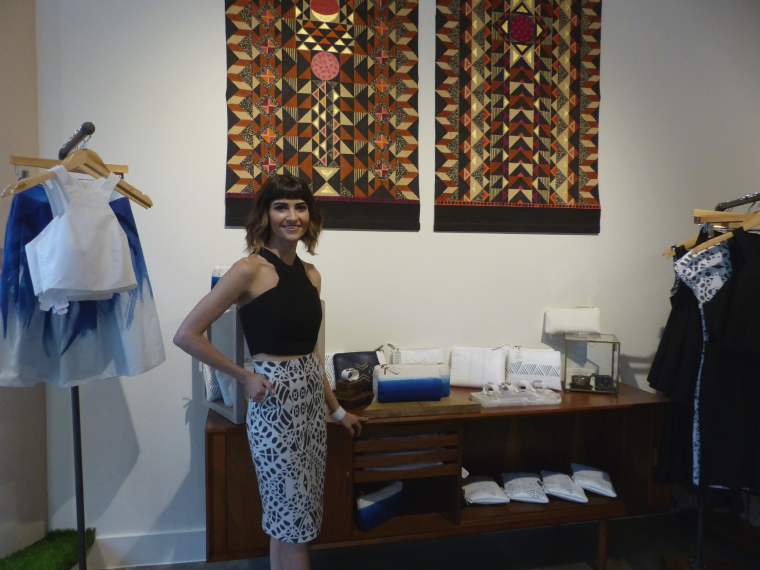 Stef standing next to her trunk show